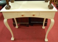 Lot 1435 - A white painted single drawer side table on...