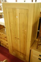 Lot 1442 - A contemporary light oak double door wardrobe,...