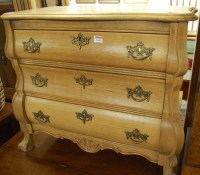 Lot 1449 - A Dutch light oak three drawer bombe chest,...