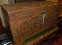 Lot 1287 - A Chinese heavily carved camphor wood hinged...