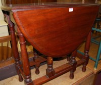 Lot 1478 - A mahogany drop leaf occasional table having a...