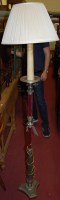 Lot 1479 - A cast metal standard lamp