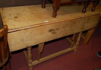 Lot 1480 - A heavily faded walnut drop flap kitchen table,...