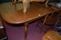 Lot 1482 - A contemporary beech drop flap kitchen table,...