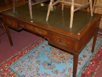 Lot 1484 - A mahogany and gilt tooled green leather inset...