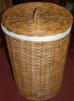 Lot 1311 - A wicker circular laundry basket and cover