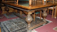 Lot 1382 - A large Belgian oak refectory table raised on...