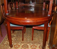 Lot 1401 - A contemporary Chinese hardwood dining suite...