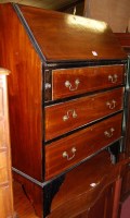 Lot 1465 - An Edwardian walnut slope front three drawer...