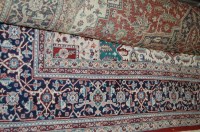 Lot 1181 - A late 20th century Persian woollen carpet,...