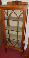Lot 1185 - A 1930s figured walnut ledgeback single door...