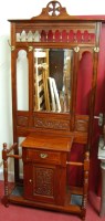 Lot 1200 - A contemporary walnut mirrorback hallstand,...
