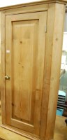 Lot 1215 - A 19th century pine single door hanging corner...