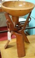 Lot 1216 - An African teak circular bowl, raised on...