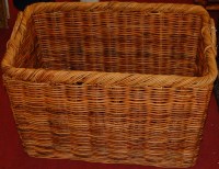 Lot 1229 - A wicket twin handled log basket, w.71cm