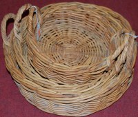 Lot 1249 - A graduated set of three circular wicker...