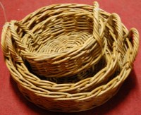 Lot 1251 - A graduated set of three wicker twin handled...