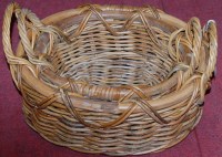 Lot 1258 - A graduated set of two wicker twin handled...