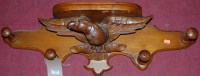 Lot 1268 - An early 20th century oak wall mounted...