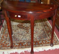 Lot 1276 - A contemporary hardwood demi-lune single...