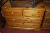 Lot 1310 - A modern pine round cornered chest of two...