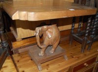 Lot 1313 - An Indian teak pedestal occasional table, the...