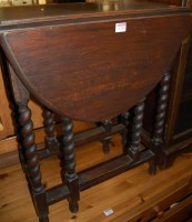 Lot 1314 - A 1930s barleytwist oak gateleg occasional...