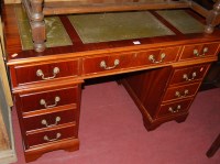 Lot 1320 - A reproduction yew wood and green leather gilt...