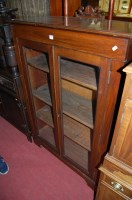 Lot 1328 - A circa 1900 mahogany double door glazed...
