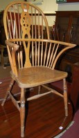 Lot 1337 - An elm and beech wheelback Windsor chair