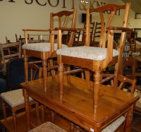 Lot 1352 - A modern pine round cornered kitchen table,...