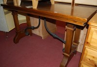 Lot 1306 - A contemporary elm long console table, having...