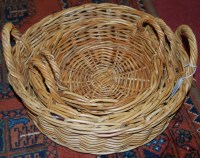 Lot 1359 - A graduated set of three circular wicker baskets