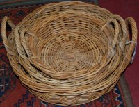 Lot 1360 - A graduated set of wicker twin handled baskets
