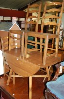 Lot 1365 - An Ercol mid elm drop leaf dining table,...