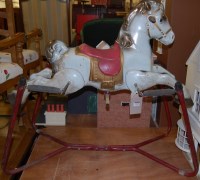 Lot 1369 - A metal childs sprung rocking horse