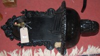 Lot 1370 - A black painted cast iron wall mounted tap