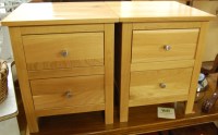 Lot 1303 - A pair of contemporary light oak two-drawer...