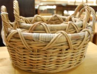 Lot 1302 - A graduated set of two wicker baskets