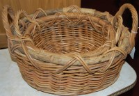 Lot 1300 - A graduated set of two wicker baskets