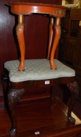 Lot 1395 - A red lacquered shaped top low occasional...