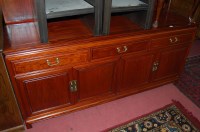 Lot 1397 - A contemporary Chinese hardwood sideboard...
