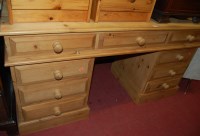 Lot 1297 - A modern pine twin pedestal writing desk,...