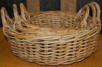 Lot 1295 - A graduated set of three circular wicker twin...