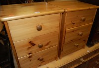 Lot 1294 - A pair of modern pine three drawer bedside chests