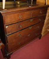 Lot 1293 - An 18th century oak chest of two short over...