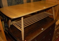 Lot 1292 - An Ercol blond elm low coffee table, having...