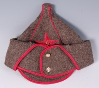 Lot 488 - A Soviet Red Army Budenovka, having a stitched...