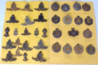 Lot 572 - A collection of assorted cap badges mainly...