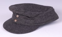 Lot 425 - A German woolen field cap.